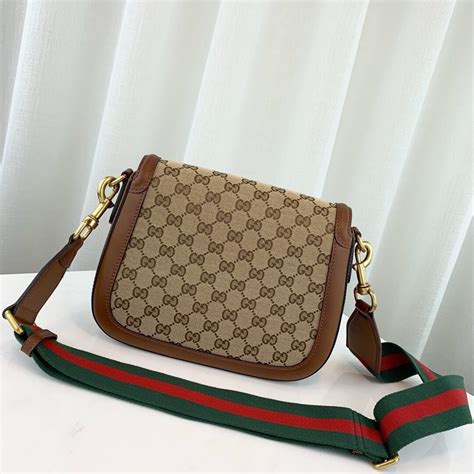 fotos de una bolsa gucci cafesita